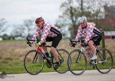 Cyclists riding together during Bluebonnet Express event, enjoying outdoor bike ride in Texas.