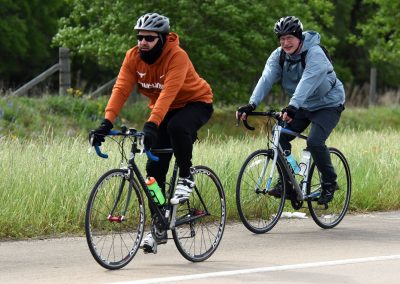Vibrant cyclists riding on scenic trail during Bluebonnet Express event, showcasing outdoor cycling adventure.