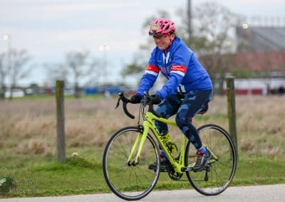 Vibrant cyclist riding a Cannondale road bike during Bluebonnet Express event in Texas.