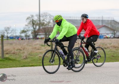 Vibrant cyclists riding Trek bikes outdoors during daytime in Bluebonnet Express event.