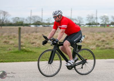 High-performance cycling on Bluebonnet Express route with electric bike, workout, and scenic Texas landscape.