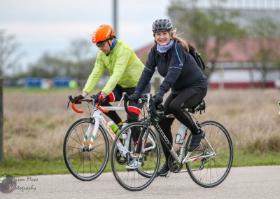 Bright female cyclist enjoying a ride on the Bluebonnet Express bike trail in Texas.