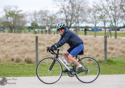 Vegan cyclist riding a Cervélo bicycle outdoors during daytime.