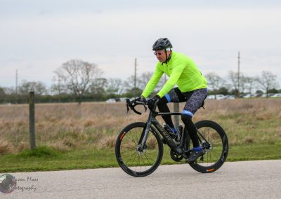 High-performance road cyclist riding a Scott e-bike during Bluebonnet Express event.