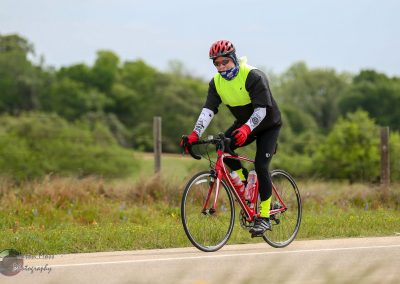 Brightly dressed cyclist enjoying a ride on the Bluebonnet Express trail in Texas.