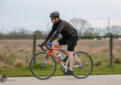 Bright orange Trek road bike on a scenic countryside ride in Texas.