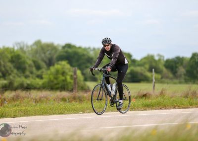 Smooth biking adventure on Bluebonnet Express rural trail with cyclist enjoying scenic outdoor ride.