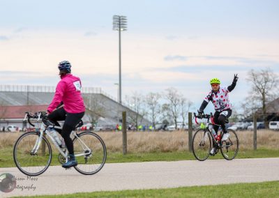 Brightly dressed cyclists participating in a bike event during the Bluebonnet Express in Texas.
