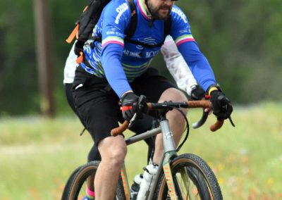 Riders on mountain bikes enjoying outdoor trail adventure, emphasizing Bluebonnet Express cycling.