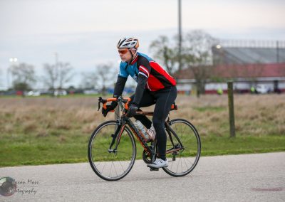 Man riding a bicycle during the Bluebonnet Express event, showcasing cycling skills and outdoor adventure.