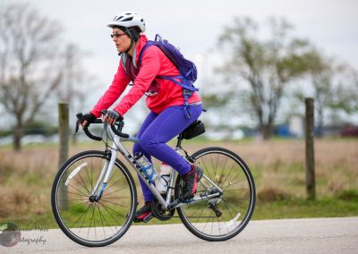 High-performance cyclist riding on a scenic trail, showcasing Bluebonnet Express bike route for outdoor adventure enthusiasts.