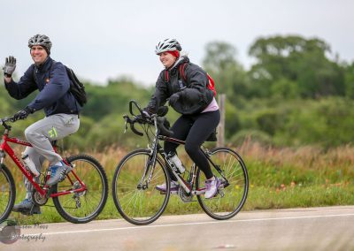 Bike ride with friends on scenic Bluebonnet Express trail, highlighting outdoor cycling and fitness activities.