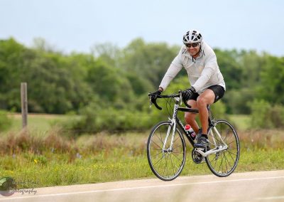 Comfortable cycling on scenic route with Bluebonnet Express bike.