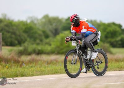 High-performance electric bicycle rider on Bluebonnet Express for eco-friendly cycling advocacy.