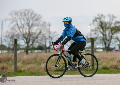 Bright blue helmet and jacket for Bluebonnet Express cycling event.