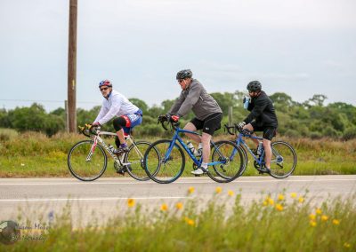 Cyclists riding through scenic countryside on Bluebonnet Express bike route for outdoor recreation and cycling events.