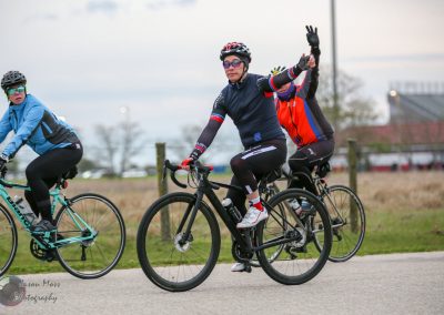 Vibrant cyclists on the Bluebonnet Express bike route during daylight outdoor riding event.
