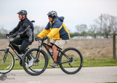 Enjoying a scenic bike ride on Bluebonnet Express trail with friends in mild weather.