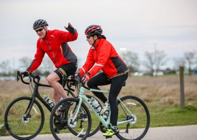 Brightly dressed cyclists enjoying a ride along the Bluebonnet Express trail in Texas.