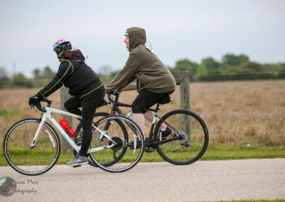 Cycling on the Bluebonnet Express route with friends during a scenic outdoor ride.