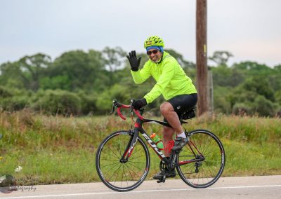 Bright yellow cyclist jacket for Bluebonnet Express bike ride event.