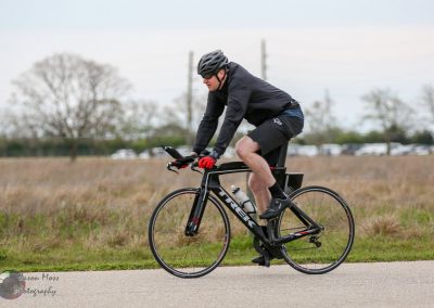 Smooth cycling with Bluebonnet Express electric bike in scenic open fields for eco-friendly transportation.