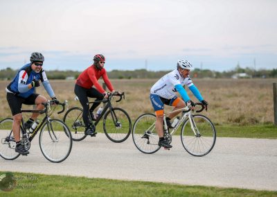 Scenic bike ride on Bluebonnet Express route with cyclists in Texas countryside.