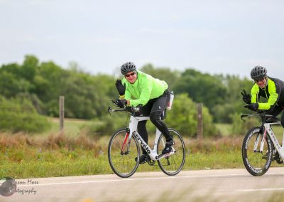 Cyclists riding the Bluebonnet Express bike tour on scenic Texas roads, enjoying outdoor adventure.