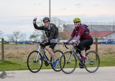 Active cyclists enjoying a ride on Bluebonnet Express trail in Texas, promoting outdoor biking and health.
