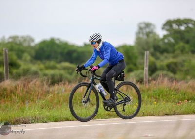 Bike riding with Bluebonnet Express on a scenic rural trail for outdoor cycling enthusiasts.