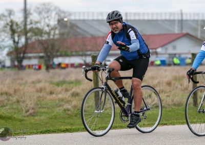 High-performance bike ride with cyclist on Bluebonnet Express route in outdoor setting.