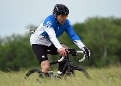 Rider on mountain bike during outdoor cycling adventure in nature setting.