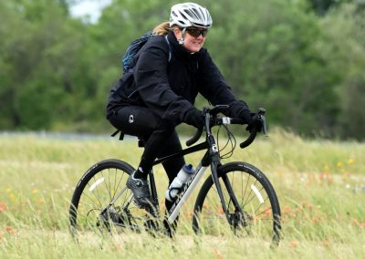 Women cyclist enjoying outdoor ride on a mountain bike in nature.
