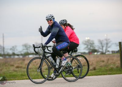 Enjoying a scenic ride on Bluebonnet Express bike trail with friends, experiencing outdoor adventure and exercise.