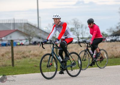Brightly dressed cyclists enjoying a ride during the Bluebonnet Express cycling event.