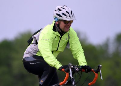 Vibrant cyclist enjoying a ride on Bluebonnet Express bike trail, perfect for outdoor adventure and cycling enthusiasts.