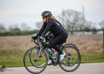 Riders enjoying a scenic cycling route on Bluebonnet Express bike trail during daytime.