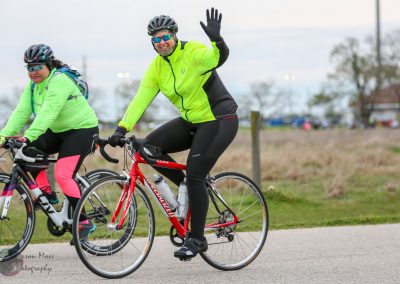 Vibrant cyclists enjoying outdoor ride with Bluebonnet Express bikes in a scenic environment.
