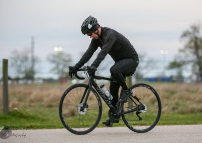 Electric bike rider on Bluebonnet Express trail, outdoors, exercising, cycling in Texas.
