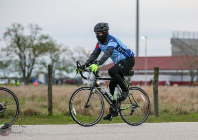 High-performance cyclist on a black Cannondale road bike during Bluebonnet Express event.