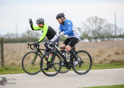 Cyclists riding on a scenic outdoor trail, promoting Bluebonnet Express bike services and Texas bike tours.