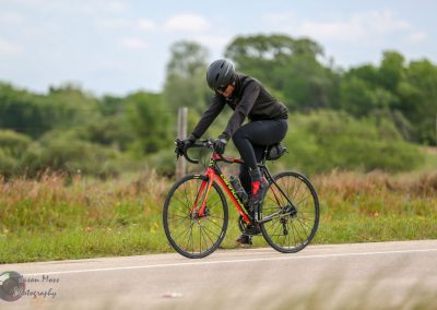 High-performance cyclist enjoying scenic bike ride on a road bike in nature.
