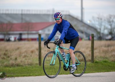 Bluebonnet Express cycling event, cyclist riding on scenic trail, outdoor bike race, Texas.