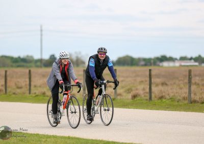 Vibrant cyclists enjoying a scenic ride on Bluebonnet Express trail, ideal for outdoor recreation and cycling tours.