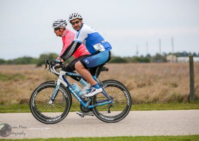 High-performance bike riders on Bluebonnet Express cycling route in Texas, competitive cycling event.