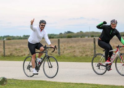 Cycling thrill with friends on Bluebonnet Express bike trail, enjoying outdoor adventure and scenic Texas landscape.