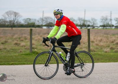 Cyclist riding a Specialized road bike during Bluebonnet Express event, promoting outdoor biking in Texas.