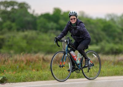 Vibrant cyclist enjoying outdoor ride on Bluebonnet Express bike trail in Texas.