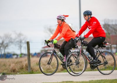Active cyclists on Bluebonnet Express bike ride enjoying scenic outdoor trail.