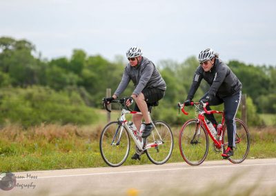 Brightly colored cycling bikes on scenic outdoor trail for Bluebonnet Express bike event.